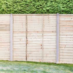 Waney edge lap panels with concrete posts.